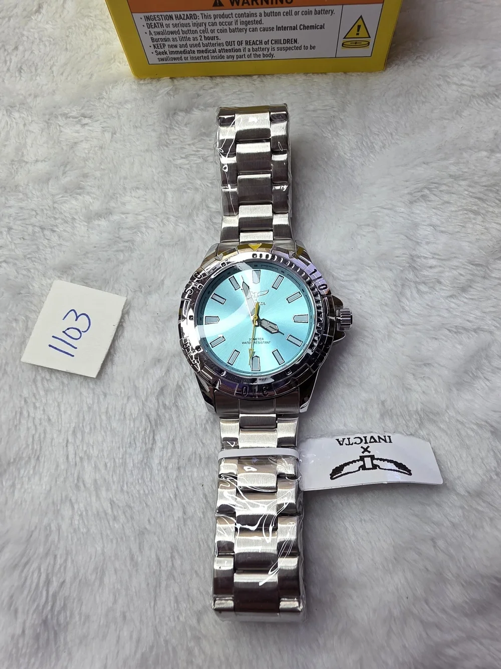 Invicta Men’s Silver Watch with Teal Dial and Yellow Accent 70051